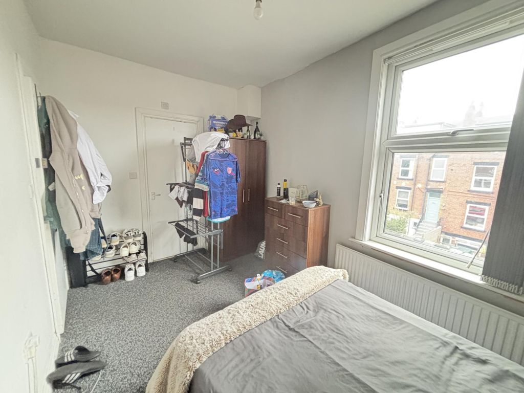 Property photo 3 of 17 Bright And Inviting Bedroom With A Large Window Pr...