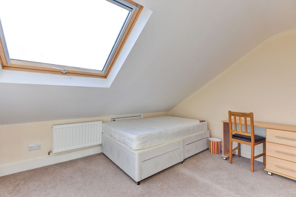 Property photo 3 of 14 A Cozy Single Bedroom Featuring A Bed, A Study Des...