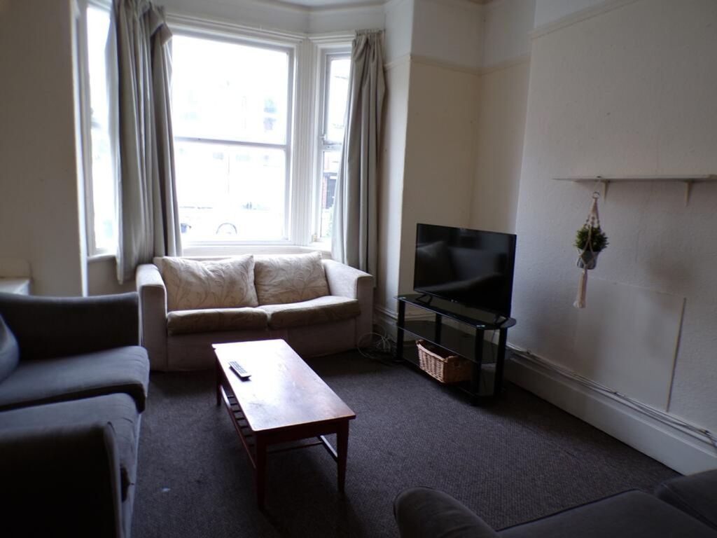 Property photo 2 of 9 A Cozy Living Room Featuring Large Windows That fi...