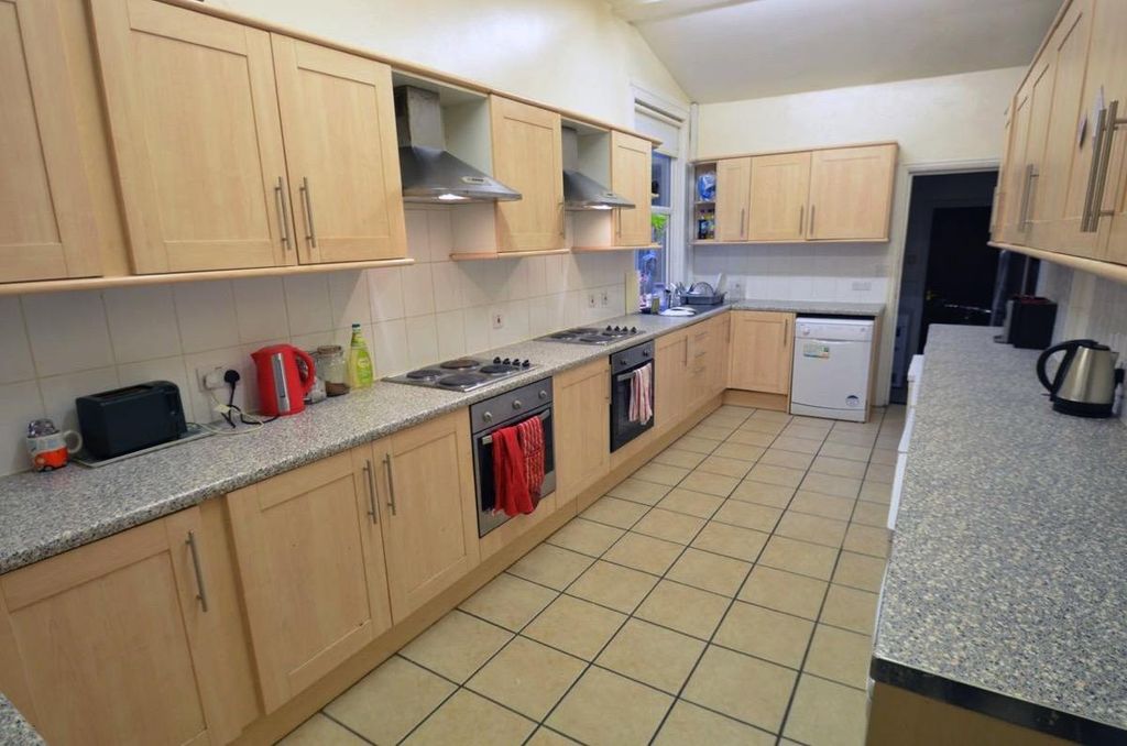 Property photo 2 of 15 Long Galley Kitchen With Light Wood Cabinets, Tile...