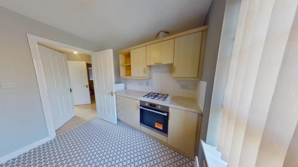 Property photo 3 of 8 A Bright And Clean Kitchen Featuring Modern Applia...