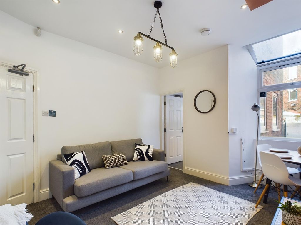 Property photo 1 of 11 A Bright And Inviting Living Room Perfect For Soci...