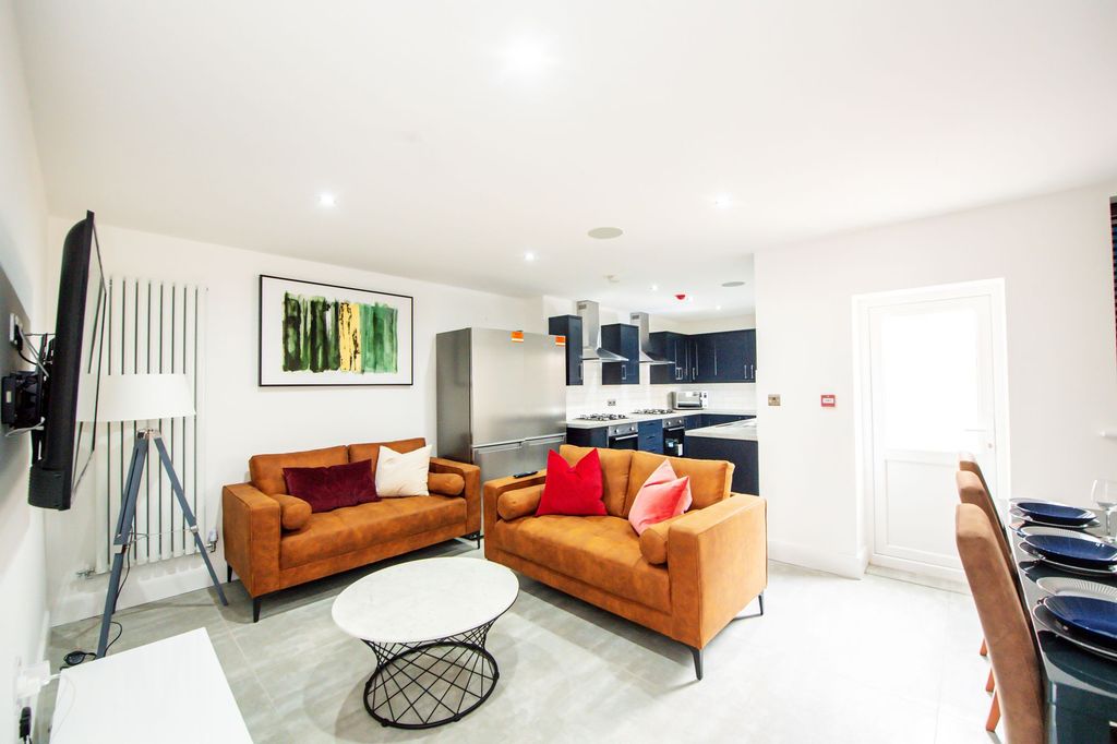 Property photo 1 of 6 Bright And Contemporary Living Room With Two Comfo...