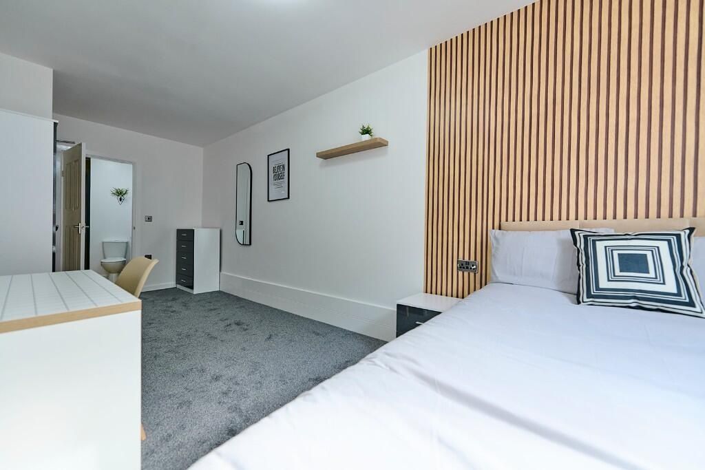 Property photo 2 of 12 Bright And Modern Master Bedroom Featuring A Comfo...
