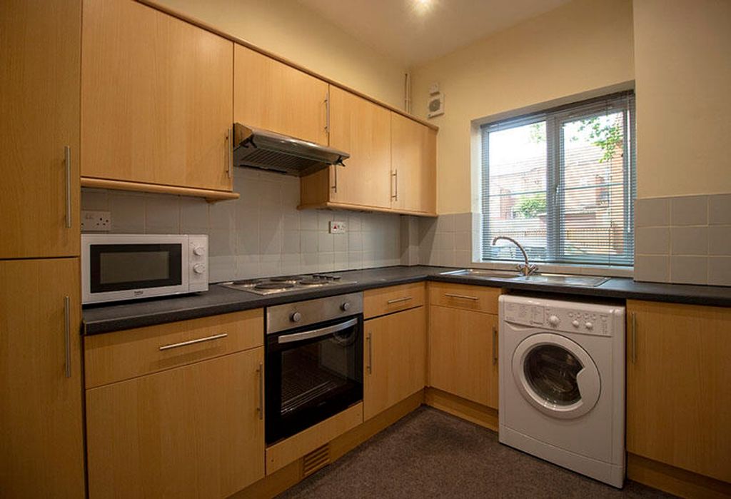 Property photo 2 of 6 This Well-Appointed Kitchen Features Modern Applia...