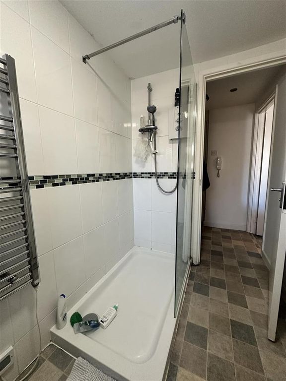 Property photo 2 of 5 Modern Tiled Shower With Sleek Glass Enclosure...
