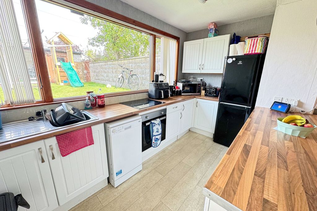 Property photo 3 of 13 Dining Kitchen