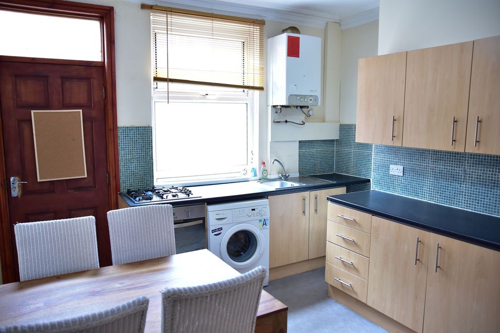 Property photo 1 of 7 Bright And Tidy Kitchen Area Featuring Modern Cabi...
