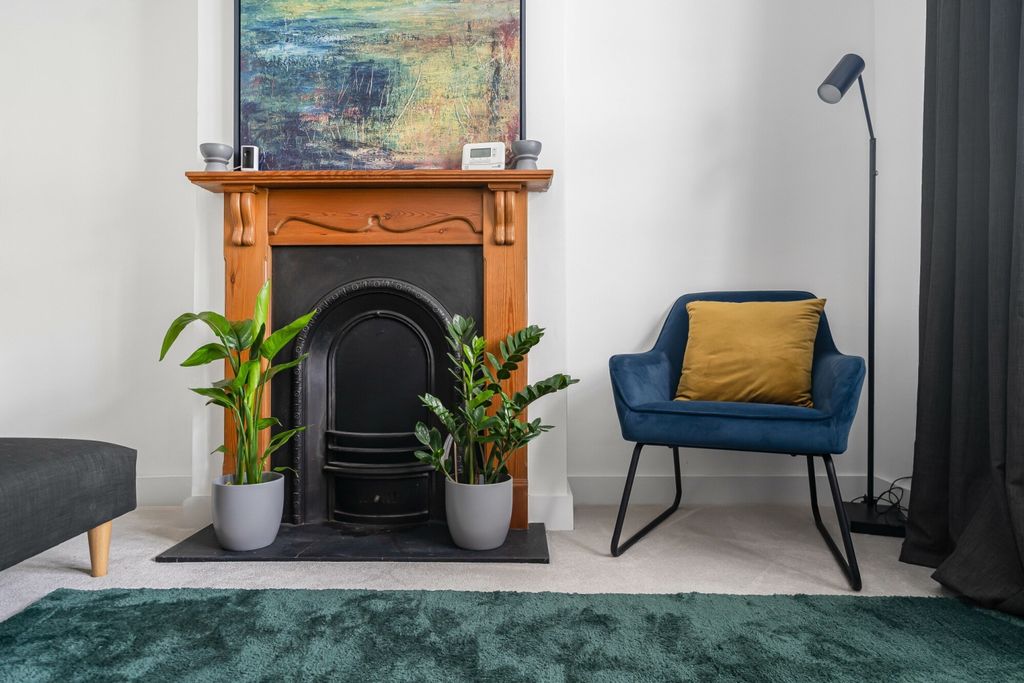 Property photo 3 of 13 Lounge Fireplace