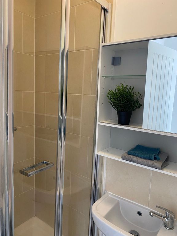 Property photo 1 of 21 A Modern Bathroom Featuring A Sleek Shower, Elegan...
