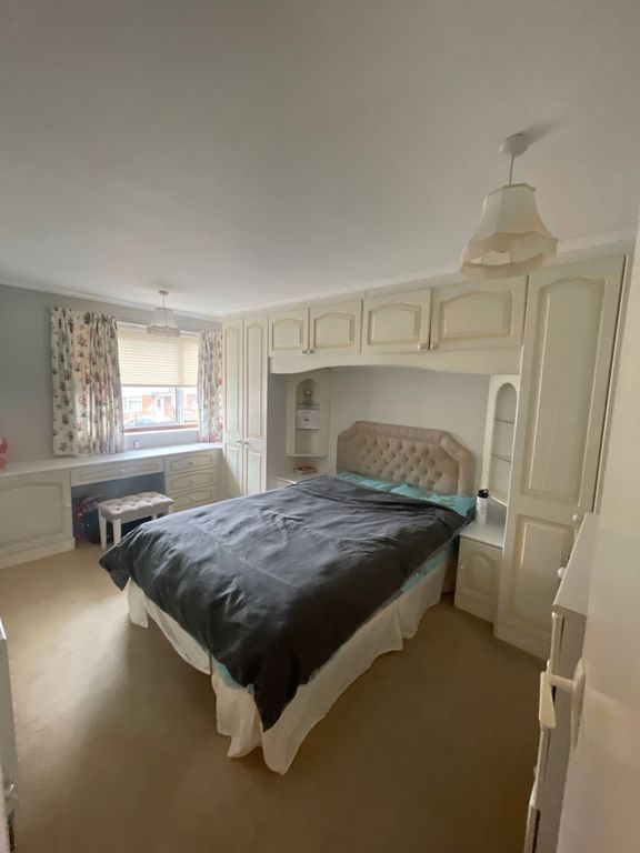 Property photo 3 of 7 Comfortable Double Bedroom Featuring Built-In Cabi...