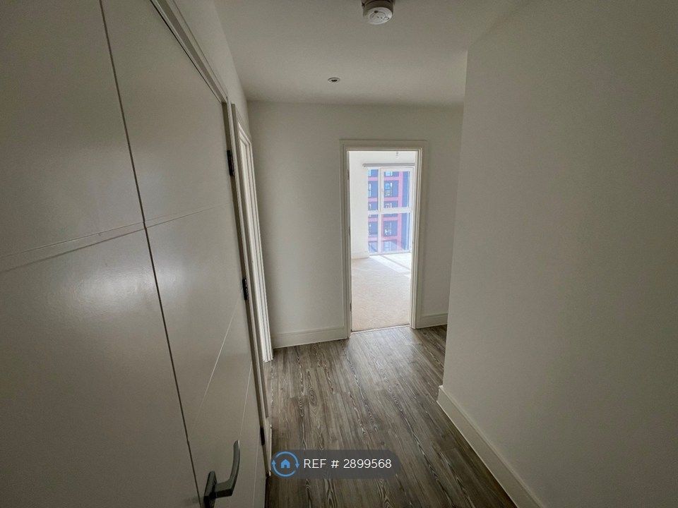 Property photo 2 of 13 Hallway With Utility To The Left