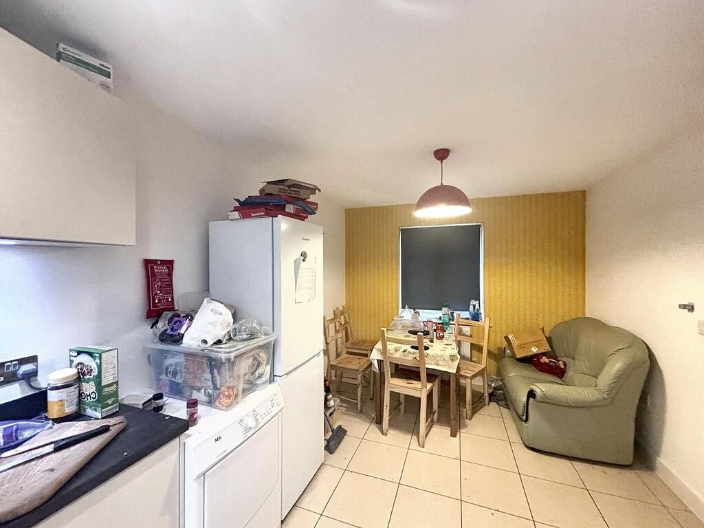 Property photo 1 of 7 A Cozy And Well-Lit Living Room Featuring Comforta...