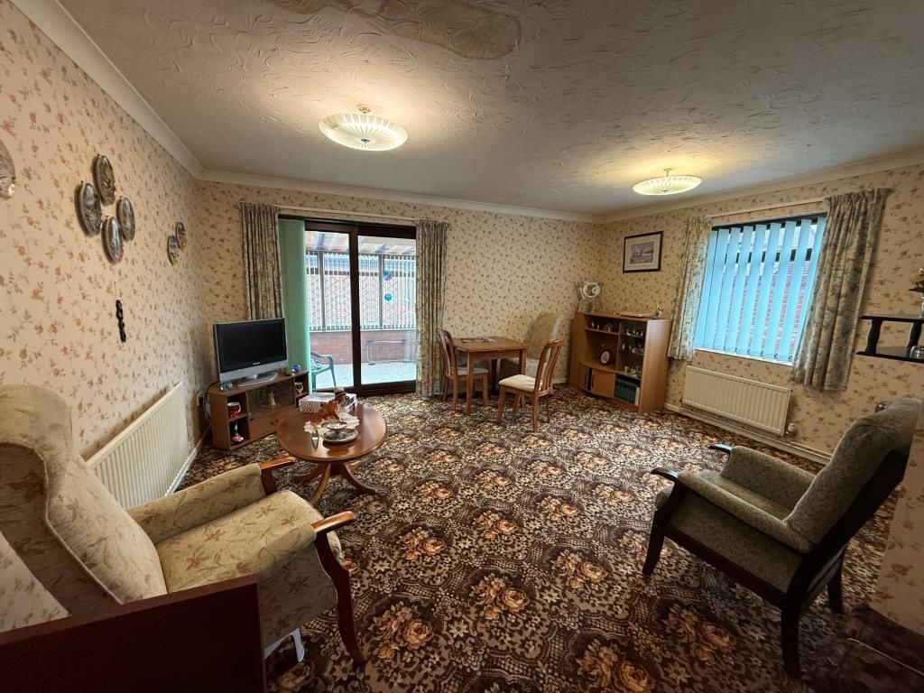 Property photo 2 of 8 Lounge With Window And Doors Going Into Conservatory