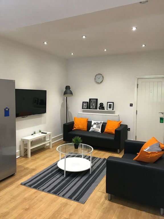 Property photo 2 of 19 A Stylish And Inviting Living Room Featuring Moder...