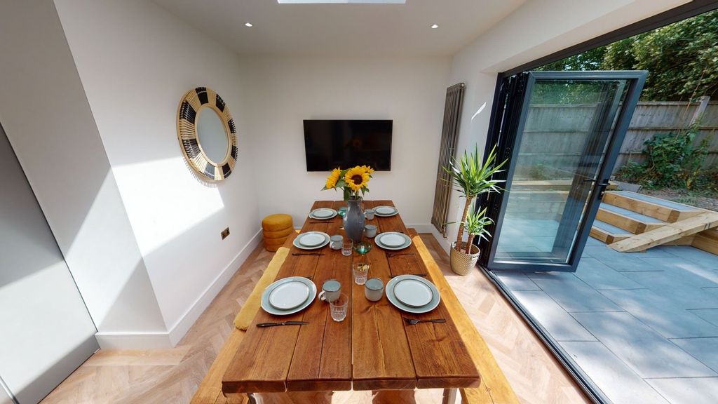 Property photo 2 of 8 Bright And Inviting Living Area Featuring A Large ...