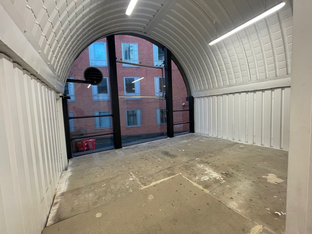 Property photo 3 of 4 The Mezzanine Level Of An Arch With White Lining.