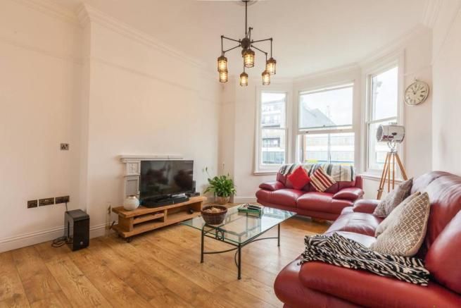 Property photo 1 of 8 A Modern Two-Bedroom Flat Set Within An Attractive Period Conversion, Ideally Located Within A Short Walk Of Clapham North Tube Station, Providing Excellent Transport Links Into Central London.