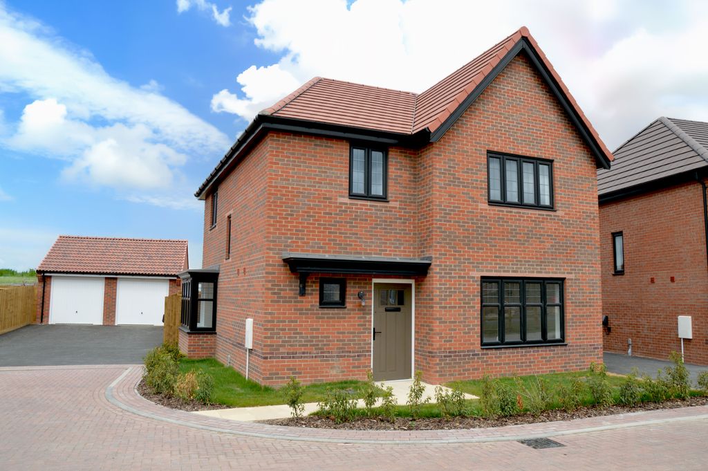 Property photo 1 of 10 A Modern Brick House With Black-Trimmed Windows Stands On A Paved Driveway