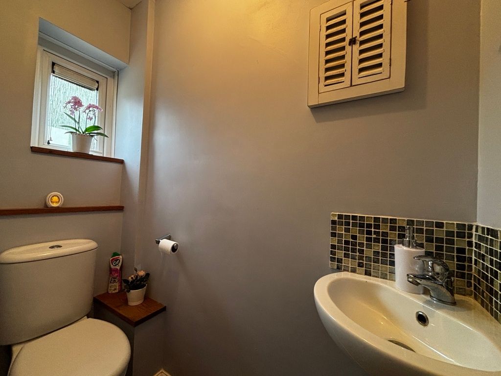 Property photo 2 of 12 Modern Cloakroom With Stylish Mosaic Tiling....