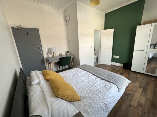 Property photo 2 of 5 Bright And Stylish Master Bedroom Featuring A Comf...