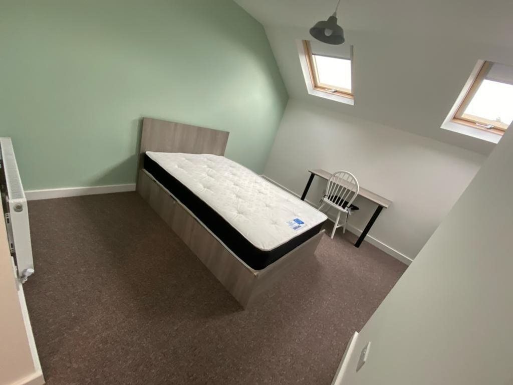 Property photo 3 of 12 A Spacious And Inviting Double Bedroom Featuring A...