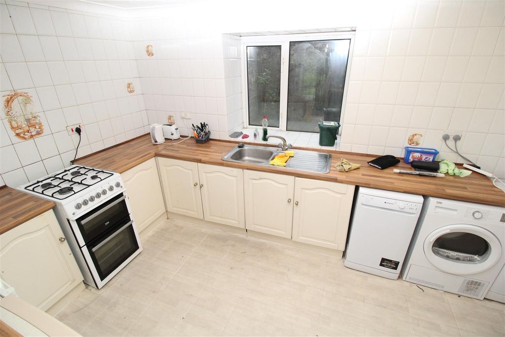 Property photo 1 of 6 Bright Kitchen With Ample Workspace And Laundry...