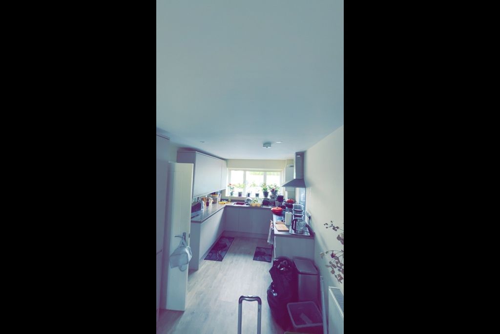 Property photo 2 of 5 Bright Galley-Style Kitchen With A Window Above Th...