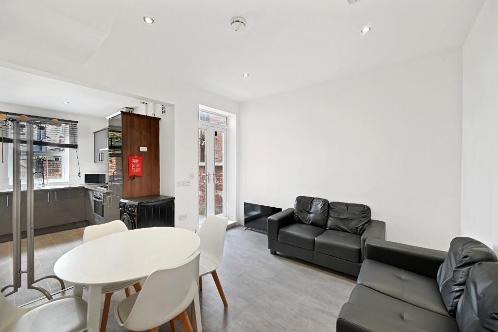 Property photo 1 of 10 A Stylish And Modern Living Room Featuring Comfort...