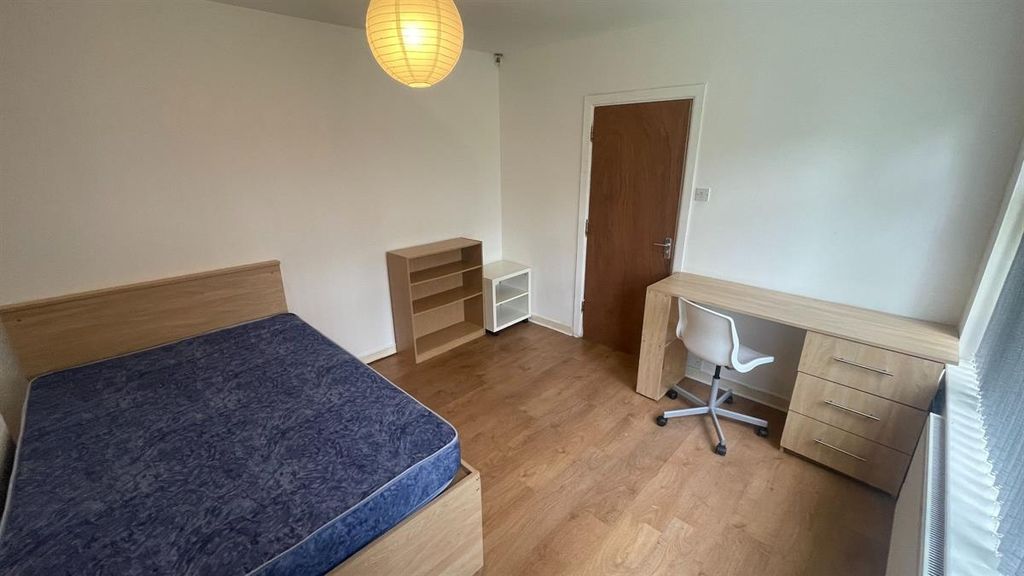 Property photo 3 of 13 A Clean And Well-Lit Bedroom With A Large Bed And ...