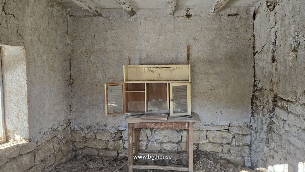 Property photo 3 of 20 An Empty Interior Room Showing Rough Plaster Walls, Wooden Beams, And Natural Light From A Window.