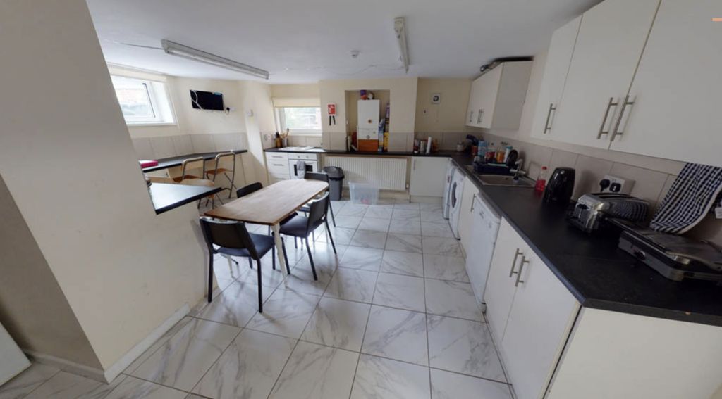 Property photo 3 of 6 Modern Kitchen Featuring Ample Cabinetry And Works...