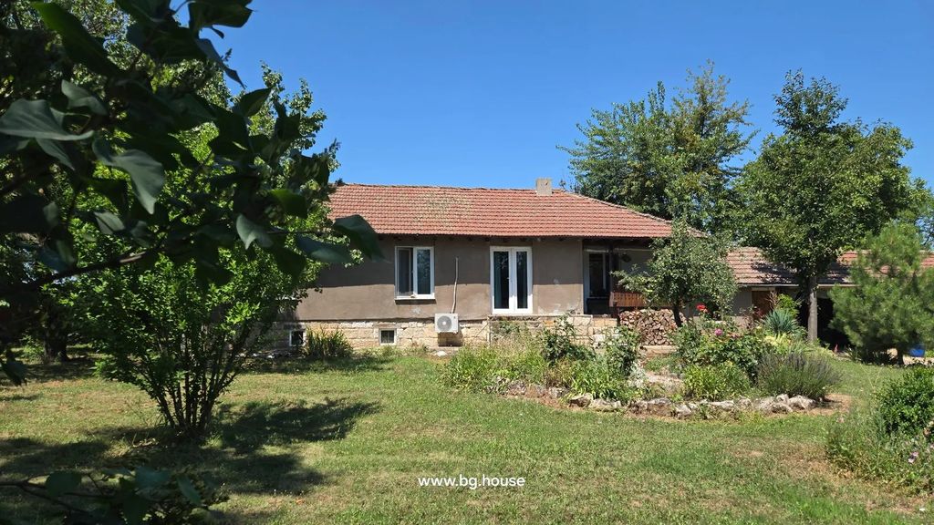Property photo 2 of 79 Front View Of House Partially Obscured By Tree Branches, Showing Tiled Roof, Windows, Garden, And Lawn.