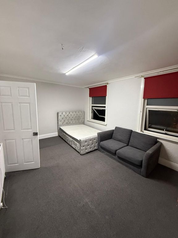 Property photo 1 of 7 Expansive Bedroom With Plush Bed And Sofa Area...