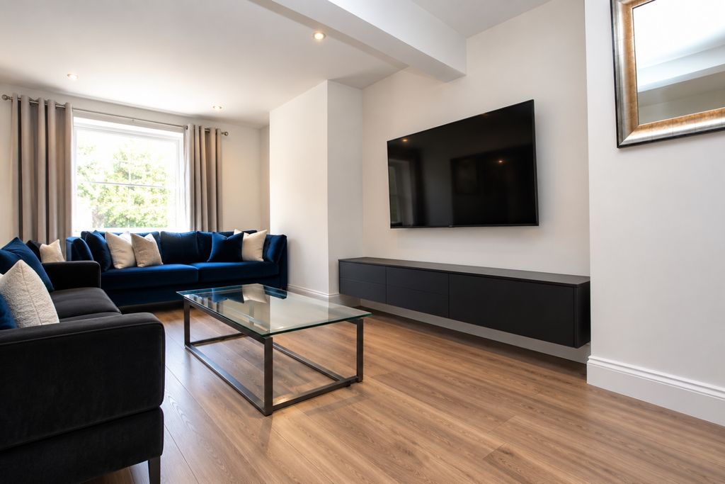 Property photo 1 of 5 Modern Navy And Charcoal Living Room