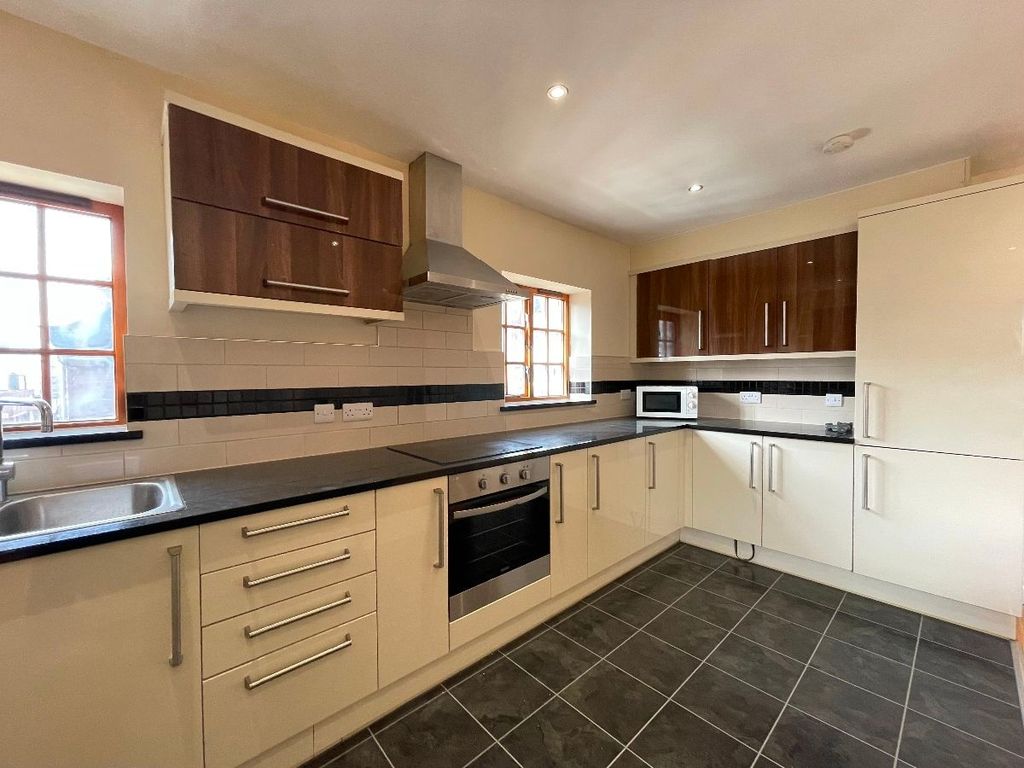 Property photo 2 of 10 Bright, Modern Kitchen Featuring Ample Countertop ...