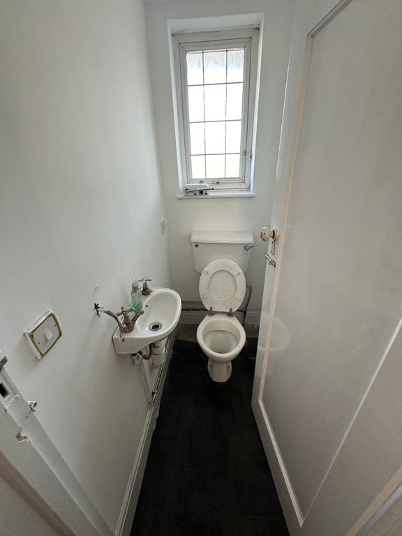 Property photo 2 of 9 Compact And Functional Toilet Room Featuring A Cla...