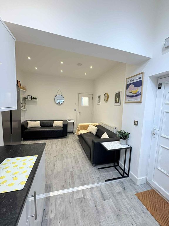 Property photo 3 of 21 Bright, Modern Living Area With Two Black Sofas, P...