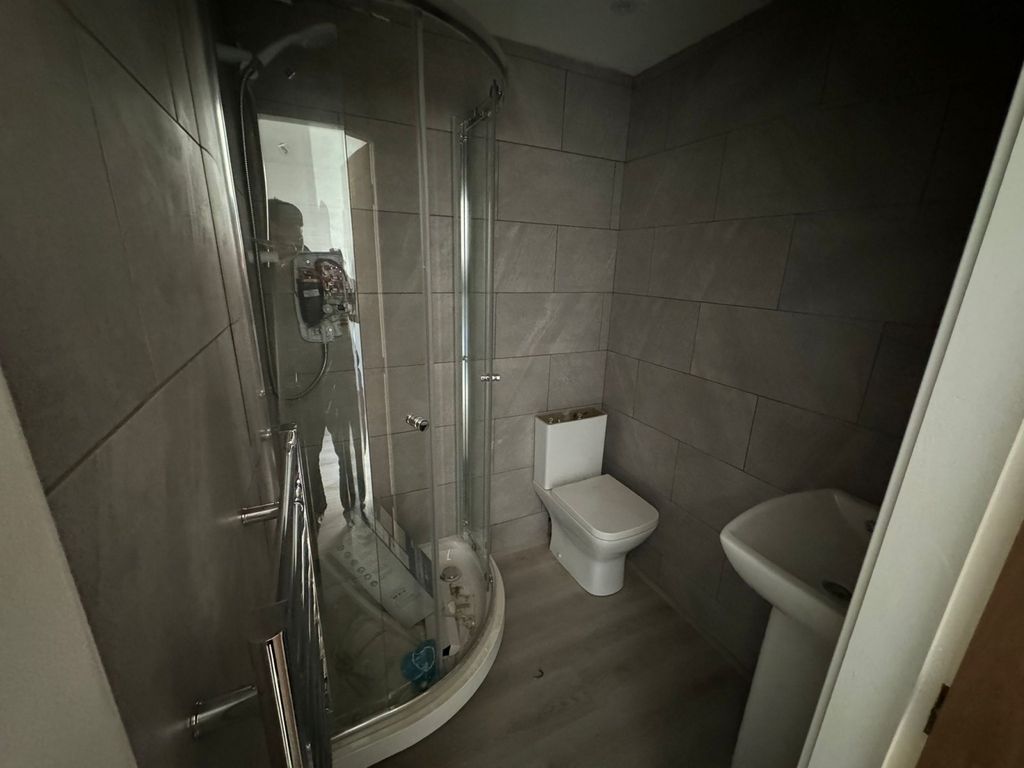 Property photo 2 of 3 A Modern Bathroom Featuring A Curved Glass Shower ...