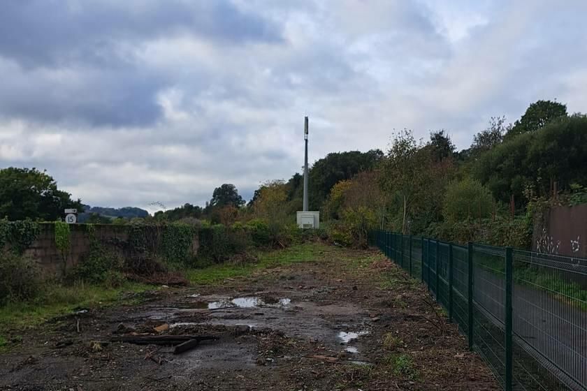 Property photo 2 of 3 A Large Plot Of Land, With Metal Fencing Around It.
