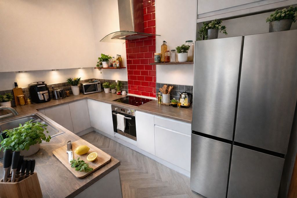 Property photo 1 of 8 Modern U-Shaped Kitchen With Stainless-Steel Appli...