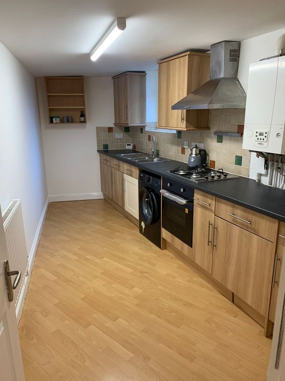 Property photo 1 of 10 A Modern Kitchen Featuring Wood-Effect Cabinetry, ...