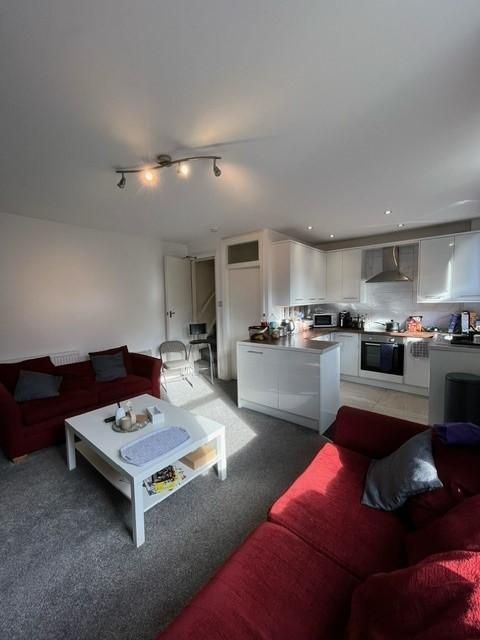 Property photo 3 of 15 Bright Open-Plan Living Area With Comfortable Red ...