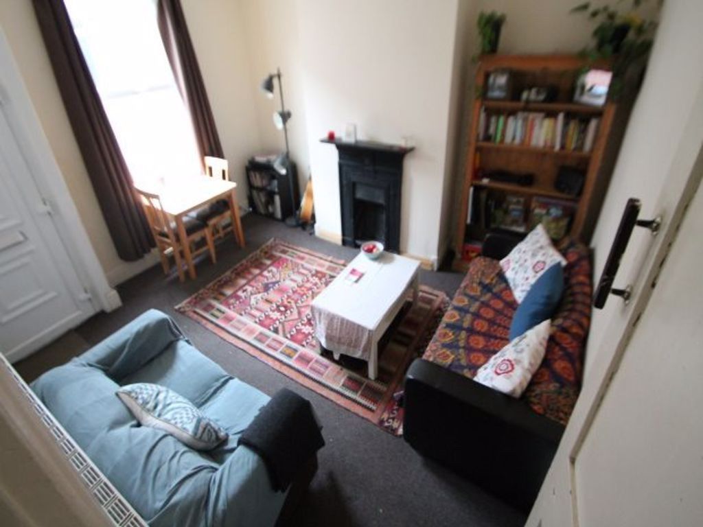 Property photo 2 of 7 A Cozy And Inviting Living Room Featuring Comforta...