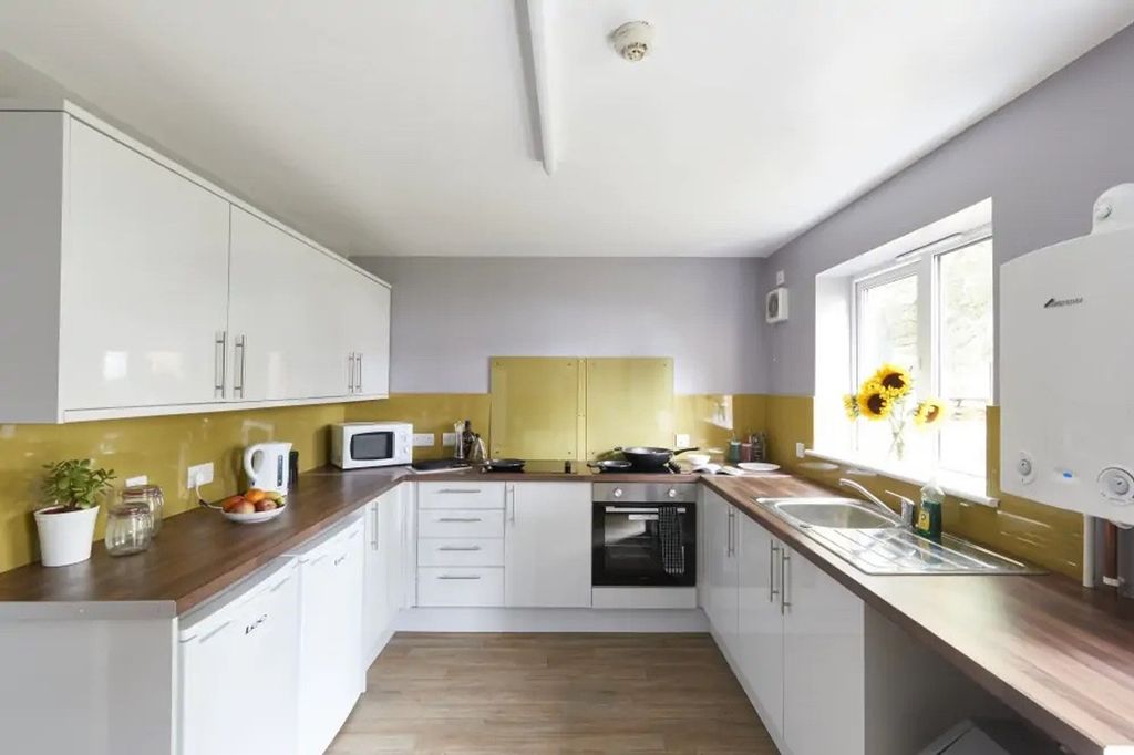 Property photo 2 of 4 A Bright And Modern Kitchen Featuring Ample Counte...