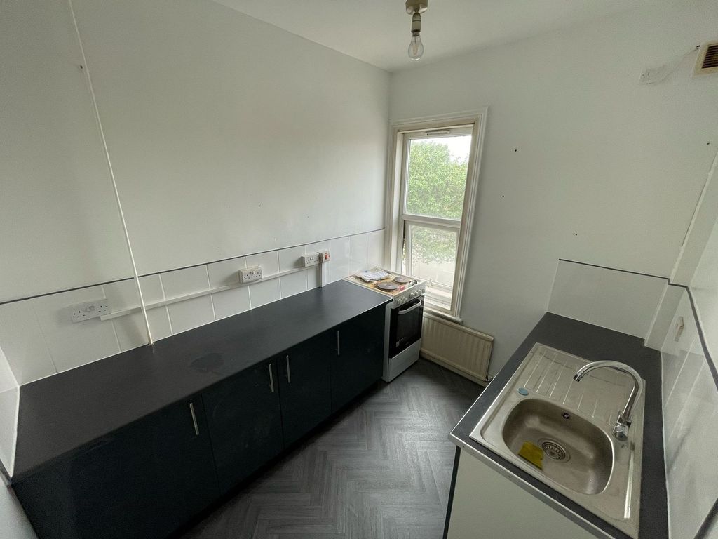 Property photo 3 of 4 Bright Kitchen Featuring Clean Countertops, A Mode...