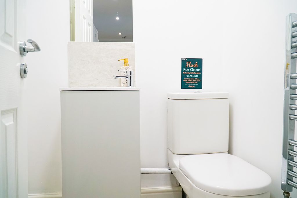 Property photo 2 of 11 A Clean And Modern Bathroom With A Large Toilet An...