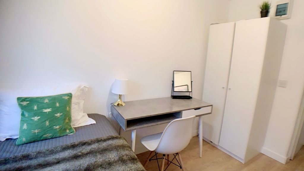 Property photo 2 of 9 A Cozy Bedroom Featuring A Bed With Decorative Pil...