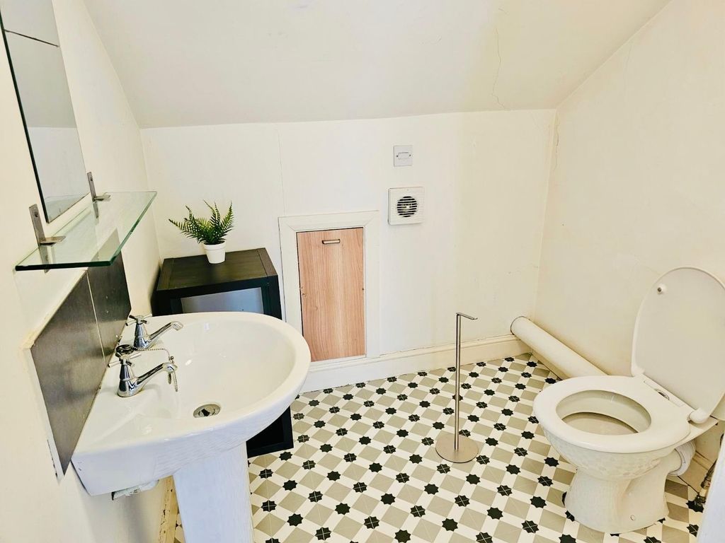 Property photo 2 of 21 Bright And Clean Bathroom With A White Sink, Toile...