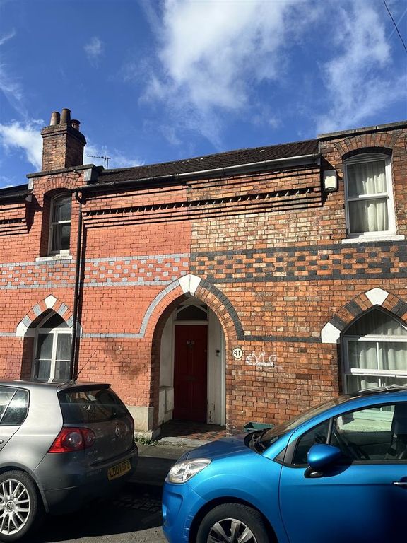 Property photo 1 of 7 Charming Red Brick Terrace Under A Clear Blue Sky...